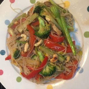 stir fried vegetables with noodles and toasted cashews