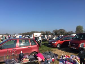 a boot sale on a field