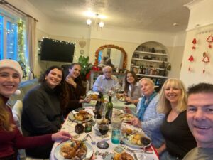 Family eating Christmas lunch around a table