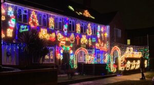 frugal Christmas - house decorated with many lights