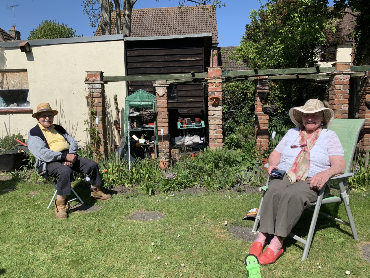 picture of elderly couple in garden