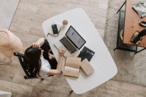 Woman at a desk with laptop to make money from home