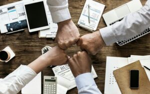 hands across a desk - a work meeting