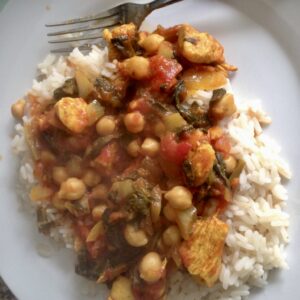 a dish of chicken and chick peas with rice