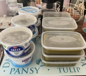Several plastic containers of home made soup