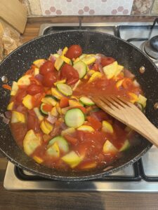 A pan of courgettes, tomatoes and peppers