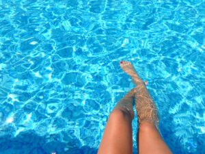 legs in a swimming pool