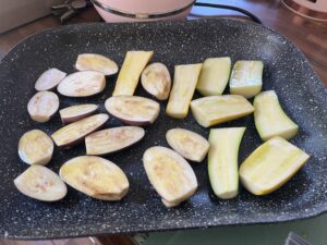 A tray of roasted aubergines and courgettes