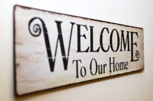 A sign saying Welcome to our home
