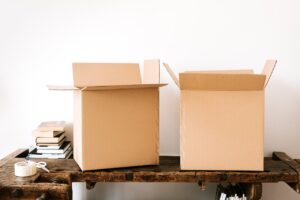 empty boxes and a pile of books