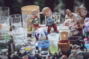 A shelf of vintage glass and ornaments
