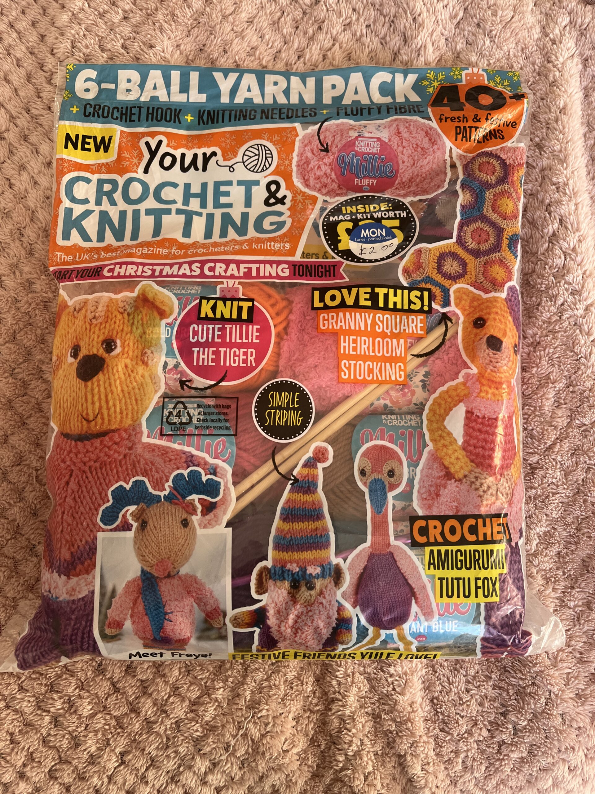 Your Knitting and Crochet magazine containing wool and needles for projects