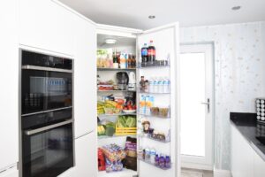 An open fridge full of food and drink