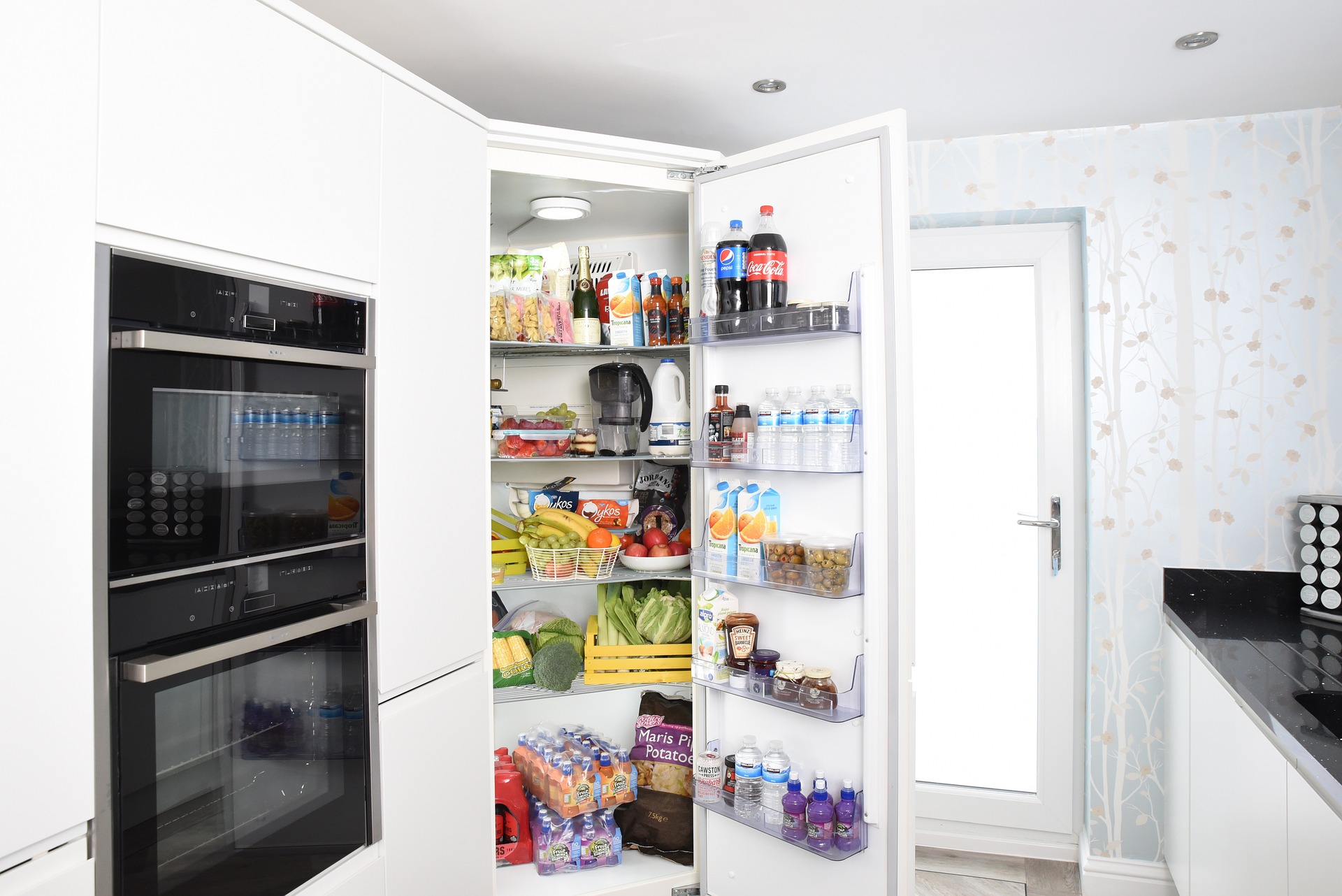An open fridge full of food and drink