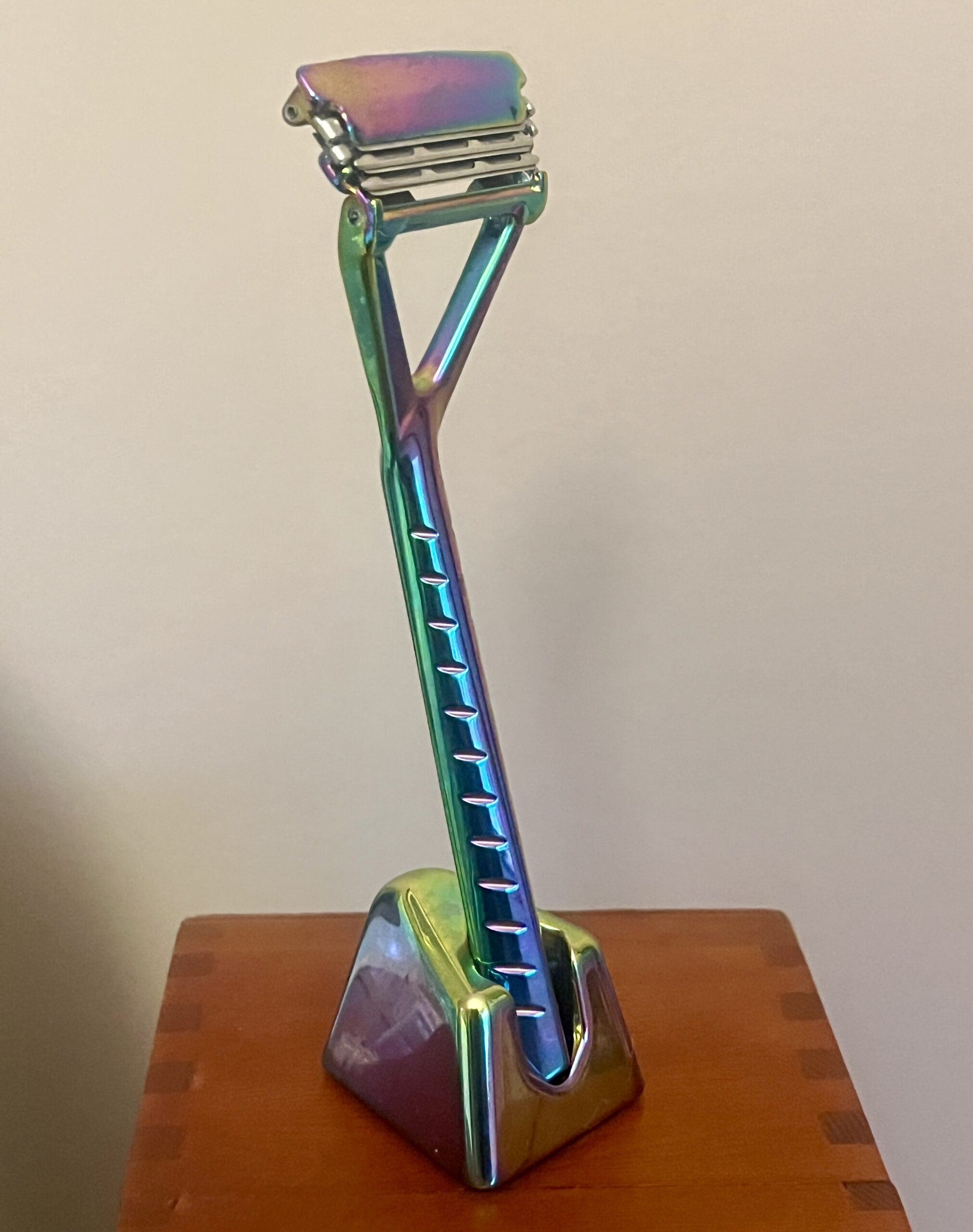 A metal razor on a stand