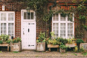 The front of a house with white window and door